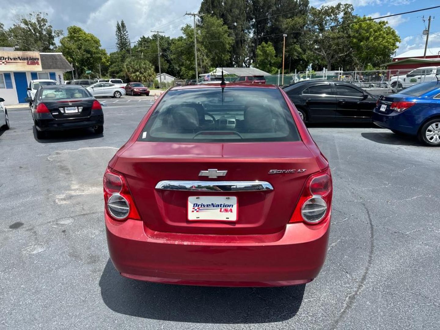 2013 RED CHEVROLET SONIC LT (1G1JC5SH2D4) with an 1.8L engine, Automatic transmission, located at 2929 9th St. West, Bradenton, 34205, (941) 242-2810, 27.473591, -82.570679 - Thanks for inquring into DriveNation USA! All vehicles listed can be viewed at www.drivenationusa.com for vehicle history reports and additonal info. We cannot quote any terms such as down payments or monthly payments without an application. You can apply directly at www.drivenationusa.com or by con - Photo#5