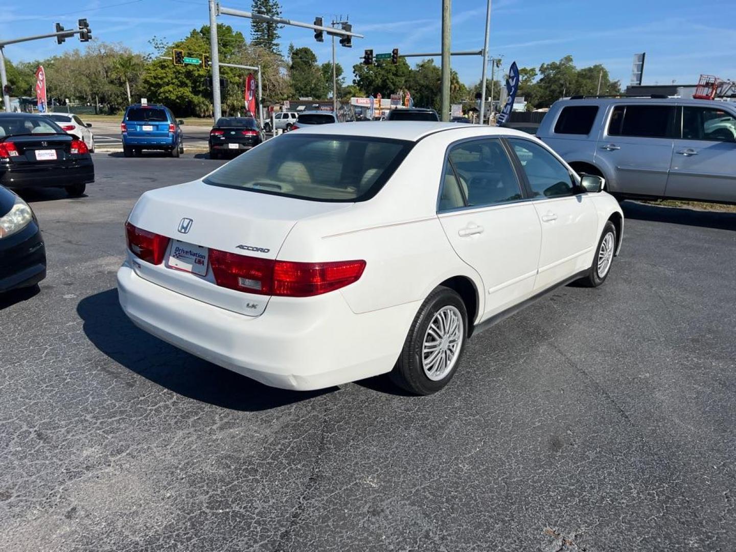 2005 WHITE HONDA ACCORD LX (1HGCM56405A) with an 2.4L engine, Automatic transmission, located at 2929 9th St. West, Bradenton, 34205, (941) 242-2810, 27.473591, -82.570679 - Photo#5