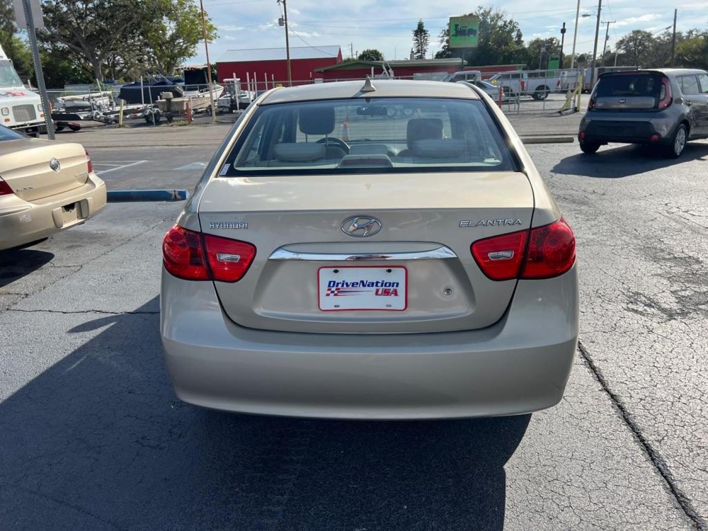 2010 TAN HYUNDAI ELANTRA BLUE (KMHDU4AD8AU) with an 2.0L engine, Automatic transmission, located at 2929 9th St. West, Bradenton, 34205, (941) 242-2810, 27.473591, -82.570679 - Photo#5