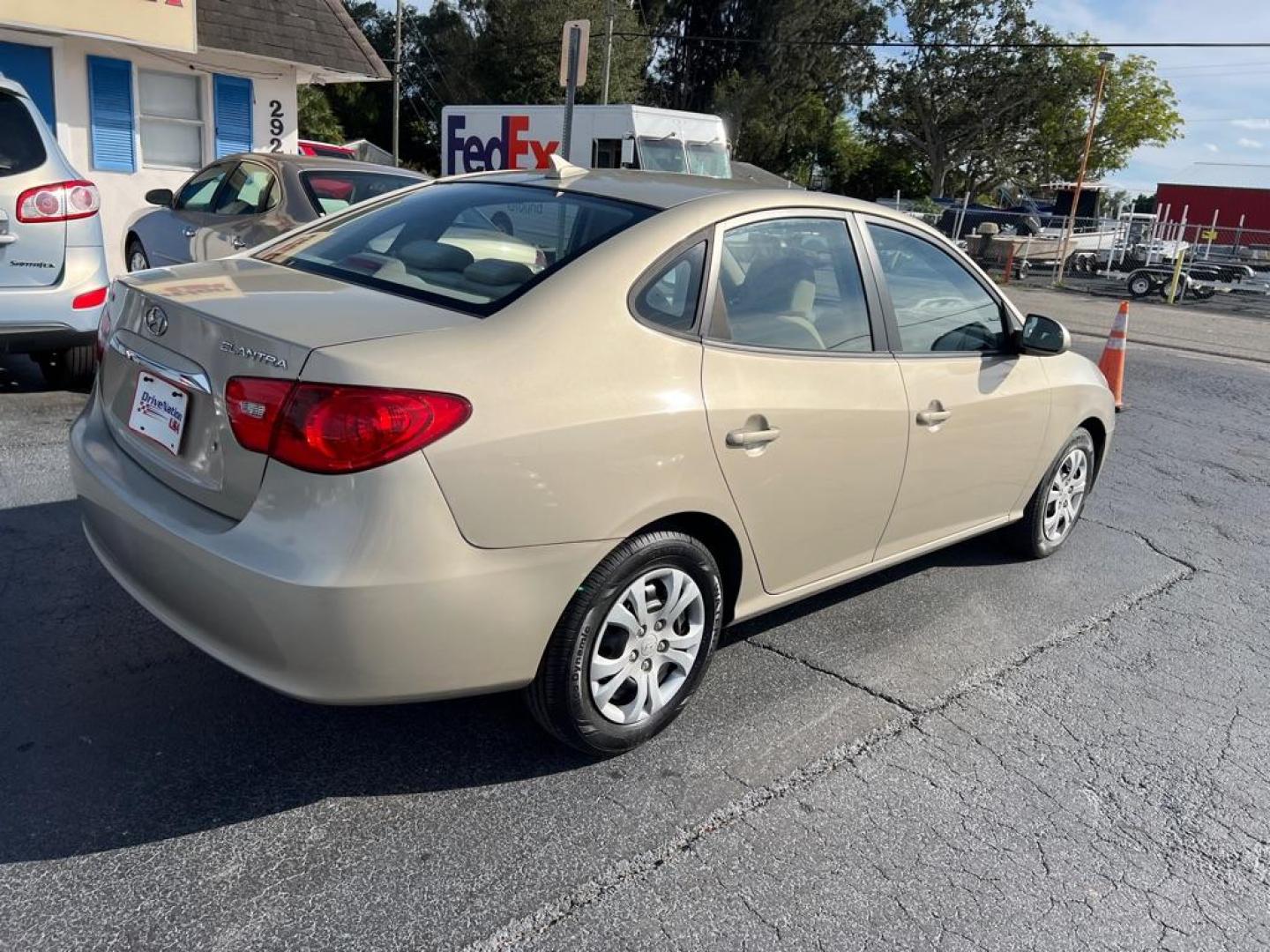 2010 TAN HYUNDAI ELANTRA BLUE (KMHDU4AD8AU) with an 2.0L engine, Automatic transmission, located at 2929 9th St. West, Bradenton, 34205, (941) 242-2810, 27.473591, -82.570679 - Photo#6