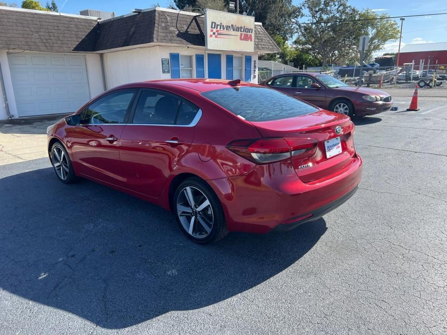 2018 RED KIA FORTE EX (3KPFL4A81JE) with an 2.0L engine, Automatic transmission, located at 2929 9th St. West, Bradenton, 34205, (941) 242-2810, 27.473591, -82.570679 - Thanks for inquring into DriveNation USA! All vehicles listed can be viewed at www.drivenationusa.com for vehicle history reports and additonal info. We cannot quote any terms such as down payments or monthly payments without an application. You can apply directly at www.drivenationusa.com or by con - Photo#6