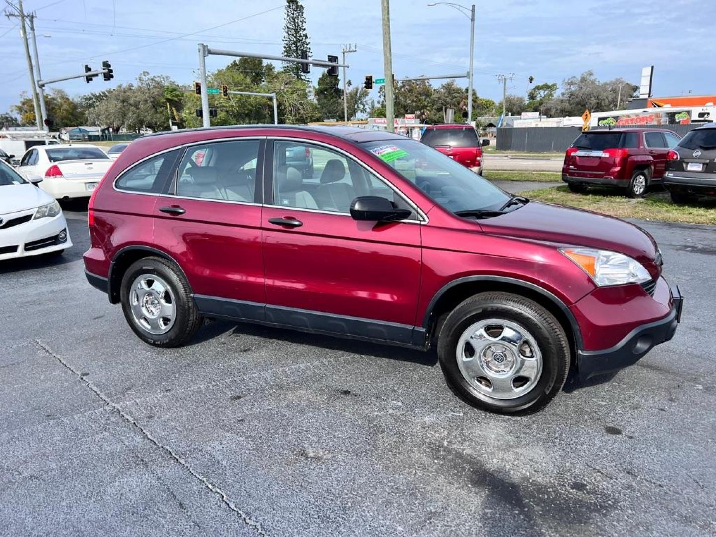 2009 MAROON HONDA CR-V LX (JHLRE38319C) with an 2.4L engine, Automatic transmission, located at 2929 9th St. West, Bradenton, 34205, (941) 242-2810, 27.473591, -82.570679 - Photo#1