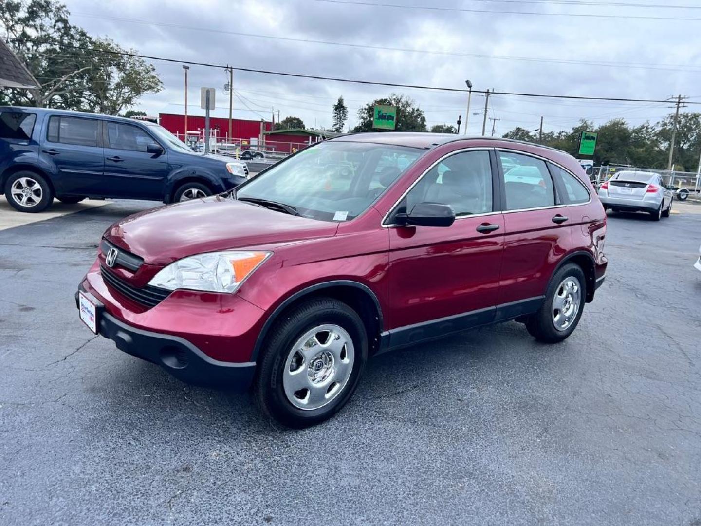 2009 MAROON HONDA CR-V LX (JHLRE38319C) with an 2.4L engine, Automatic transmission, located at 2929 9th St. West, Bradenton, 34205, (941) 242-2810, 27.473591, -82.570679 - Photo#4