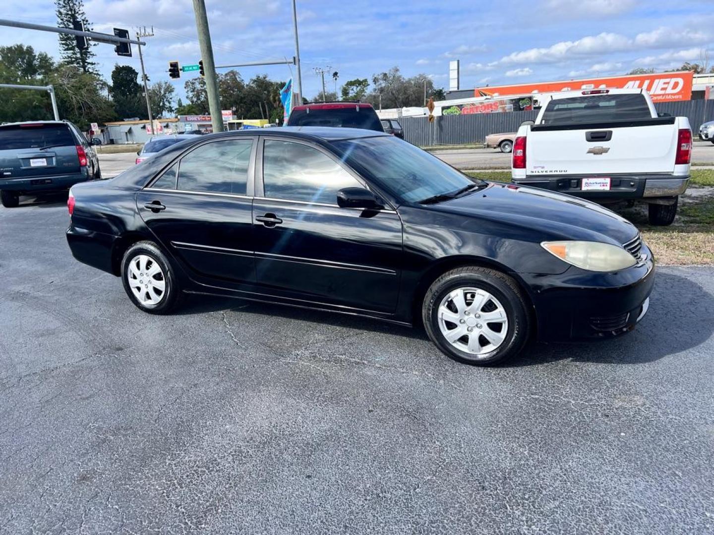 2005 BLACK TOYOTA CAMRY LE (4T1BE32K75U) with an 2.4L engine, Automatic transmission, located at 2929 9th St. West, Bradenton, 34205, (941) 242-2810, 27.473591, -82.570679 - Photo#0