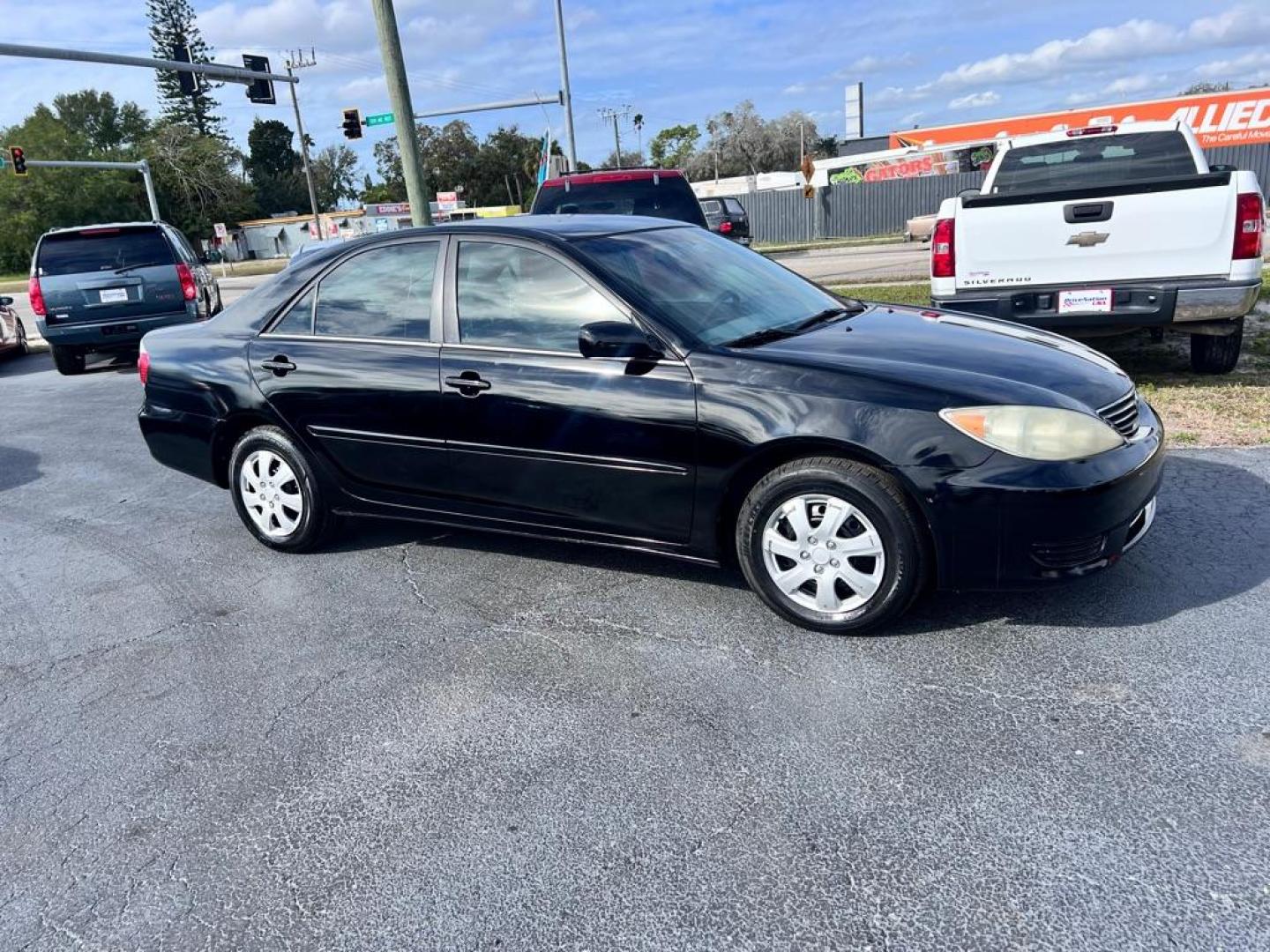 2005 BLACK TOYOTA CAMRY LE (4T1BE32K75U) with an 2.4L engine, Automatic transmission, located at 2929 9th St. West, Bradenton, 34205, (941) 242-2810, 27.473591, -82.570679 - Photo#11