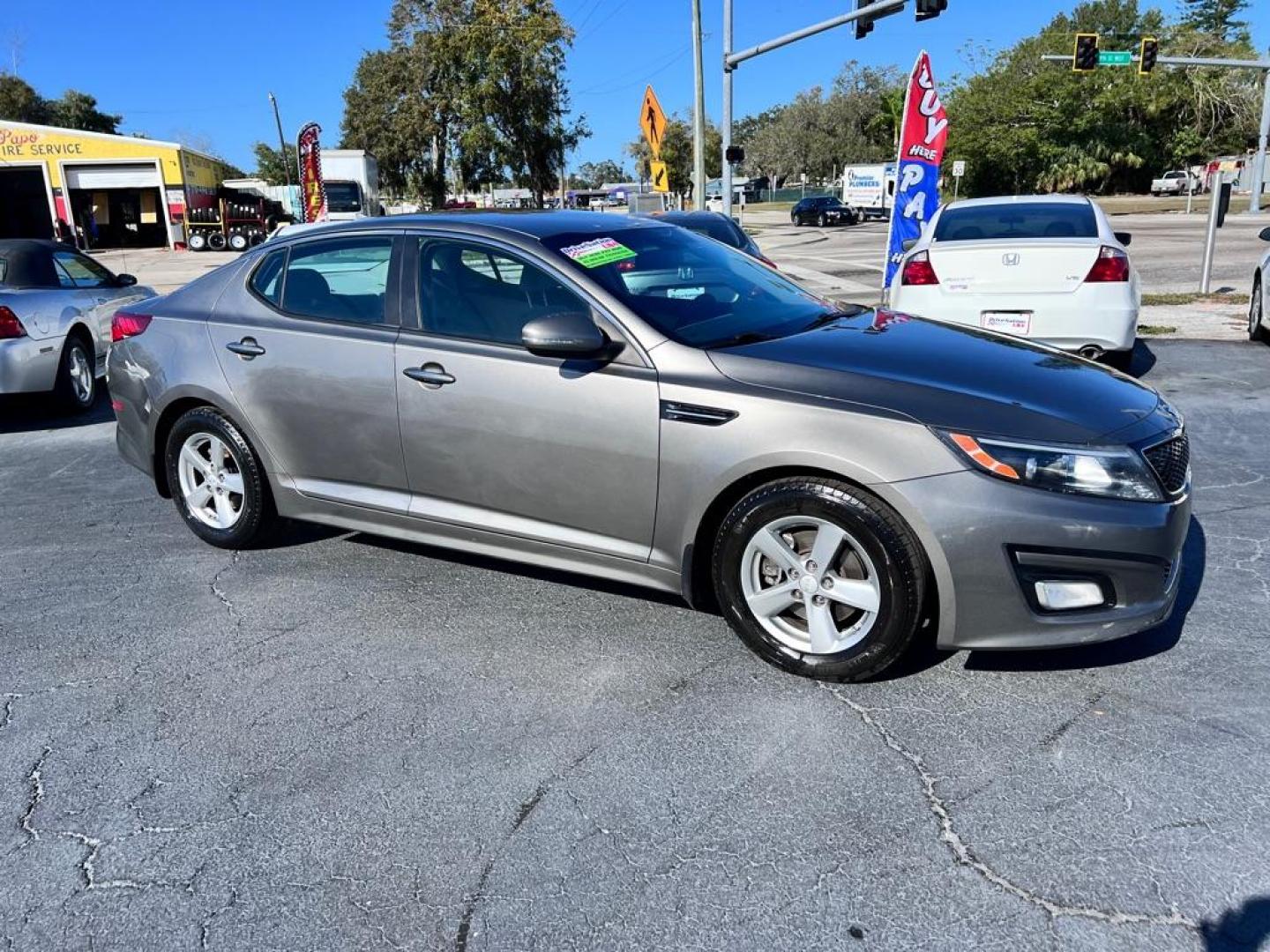 2015 GRAY KIA OPTIMA LX (5XXGM4A74FG) with an 2.4L engine, Automatic transmission, located at 2929 9th St. West, Bradenton, 34205, (941) 242-2810, 27.473591, -82.570679 - Photo#0