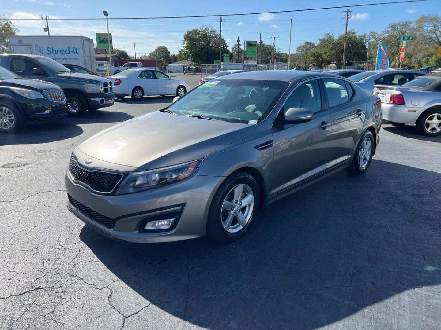 2015 GRAY KIA OPTIMA LX (5XXGM4A74FG) with an 2.4L engine, Automatic transmission, located at 2929 9th St. West, Bradenton, 34205, (941) 242-2810, 27.473591, -82.570679 - Photo#4