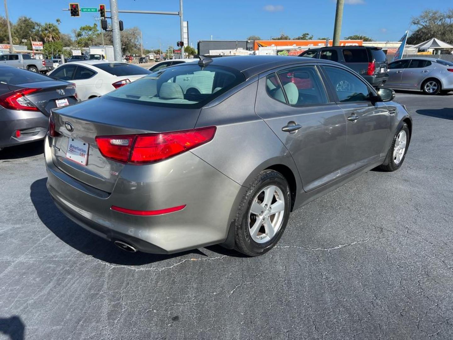 2015 GRAY KIA OPTIMA LX (5XXGM4A74FG) with an 2.4L engine, Automatic transmission, located at 2929 9th St. West, Bradenton, 34205, (941) 242-2810, 27.473591, -82.570679 - Photo#6