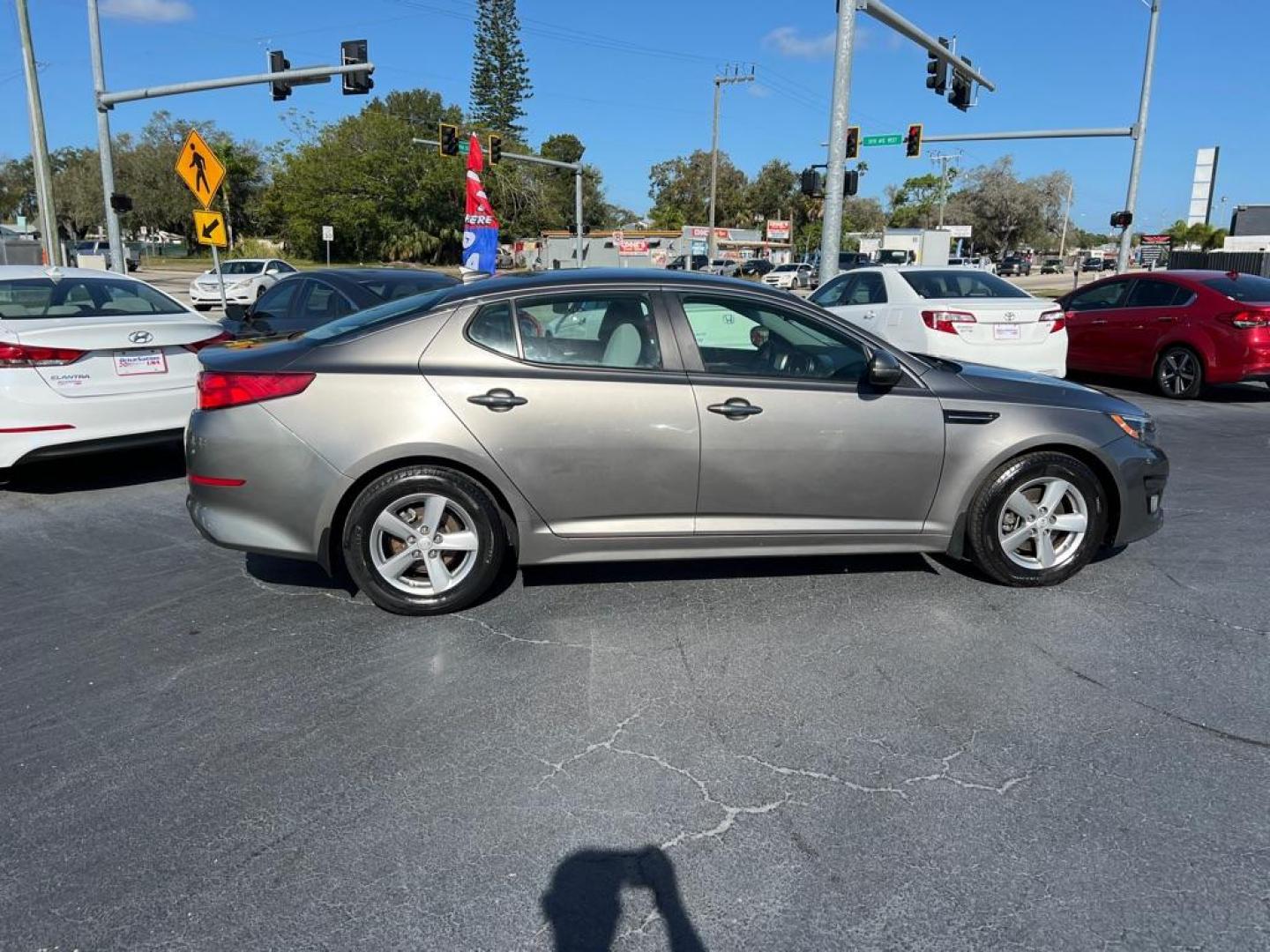 2015 GRAY KIA OPTIMA LX (5XXGM4A74FG) with an 2.4L engine, Automatic transmission, located at 2929 9th St. West, Bradenton, 34205, (941) 242-2810, 27.473591, -82.570679 - Photo#7