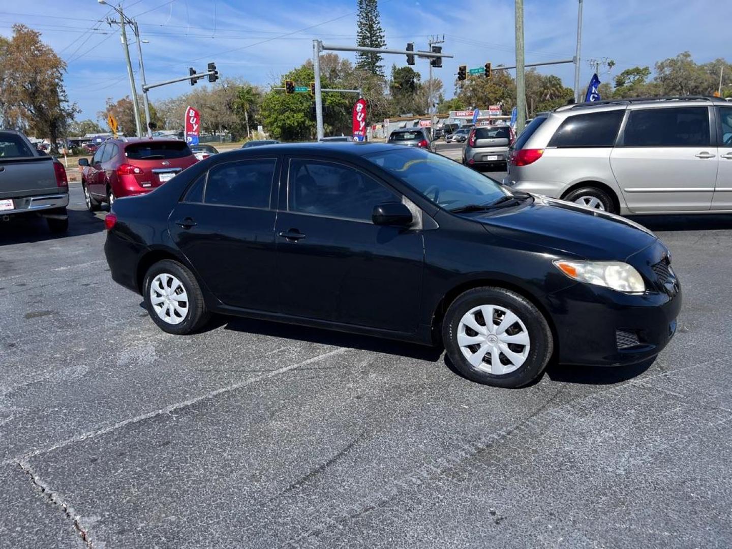 2009 BLACK TOYOTA COROLLA LE (JTDBL40E599) with an 1.8L engine, Automatic transmission, located at 2929 9th St. West, Bradenton, 34205, (941) 242-2810, 27.473591, -82.570679 - Photo#0