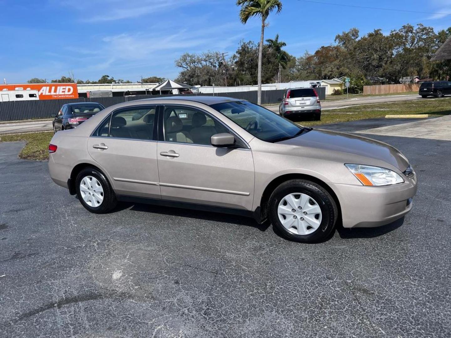 2004 GOLD HONDA ACCORD LX (JHMCM56414C) with an 2.4L engine, Automatic transmission, located at 2929 9th St. West, Bradenton, 34205, (941) 242-2810, 27.473591, -82.570679 - Photo#0