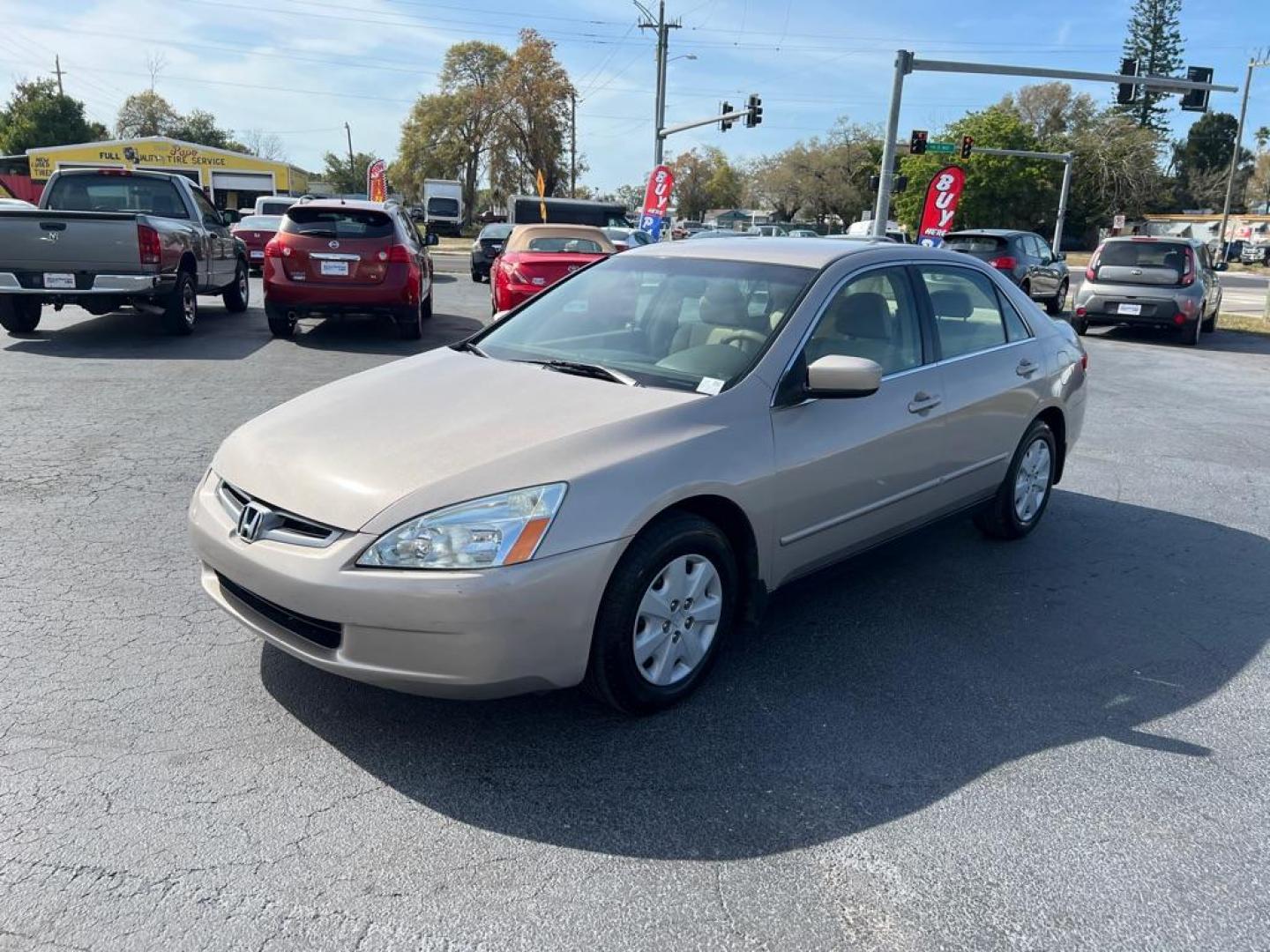 2004 GOLD HONDA ACCORD LX (JHMCM56414C) with an 2.4L engine, Automatic transmission, located at 2929 9th St. West, Bradenton, 34205, (941) 242-2810, 27.473591, -82.570679 - Photo#3