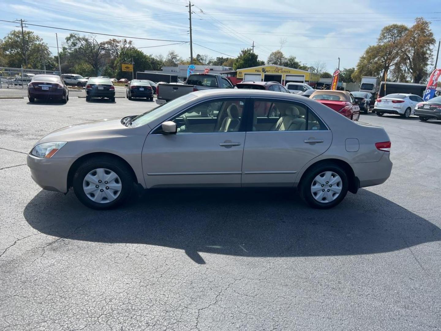 2004 GOLD HONDA ACCORD LX (JHMCM56414C) with an 2.4L engine, Automatic transmission, located at 2929 9th St. West, Bradenton, 34205, (941) 242-2810, 27.473591, -82.570679 - Photo#4