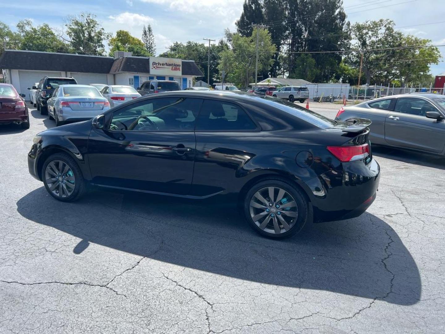 2013 BLACK KIA FORTE SX (KNAFW6A39D5) with an 2.4L engine, Automatic transmission, located at 2929 9th St. West, Bradenton, 34205, (941) 242-2810, 27.473591, -82.570679 - Thanks for inquring into DriveNation USA! All vehicles listed can be viewed at www.drivenationusa.com for vehicle history reports and additonal info. We cannot quote any terms such as down payments or monthly payments without an application. You can apply directly at www.drivenationusa.com or by con - Photo#4