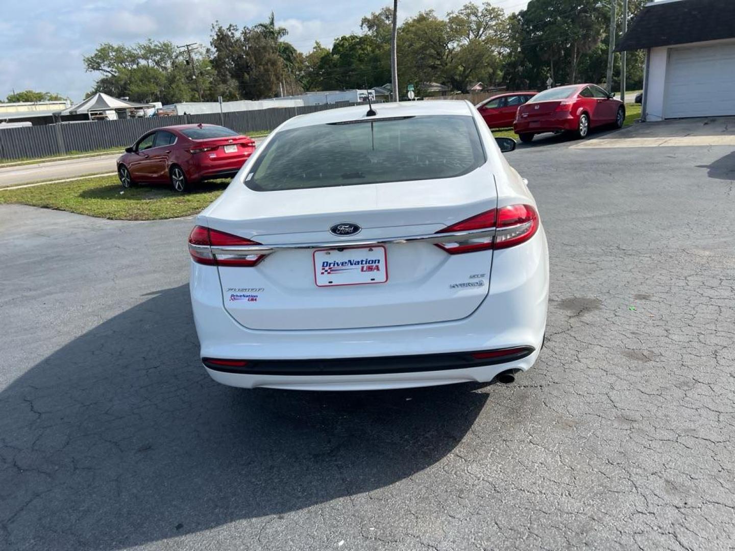 2018 WHITE FORD FUSION SE HYBRID (3FA6P0LU1JR) with an 2.0L engine, Continuously Variable transmission, located at 2929 9th St. West, Bradenton, 34205, (941) 242-2810, 27.473591, -82.570679 - Photo#6