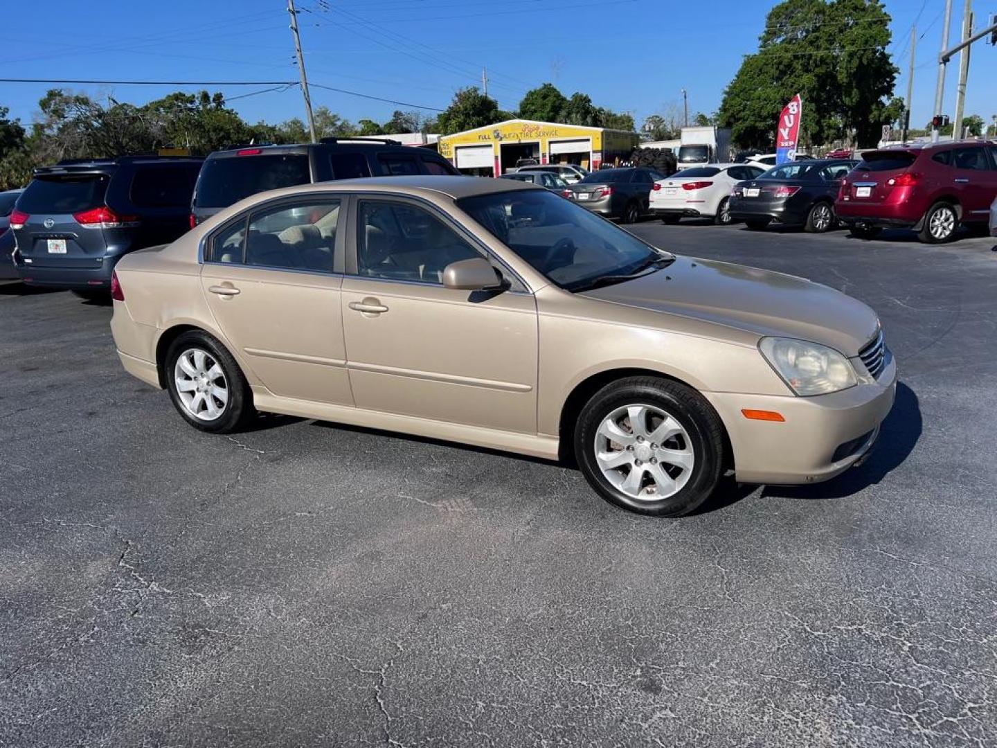 2008 GOLD KIA OPTIMA LX (KNAGE124385) with an 2.7L engine, Automatic transmission, located at 2929 9th St. West, Bradenton, 34205, (941) 242-2810, 27.473591, -82.570679 - Photo#0