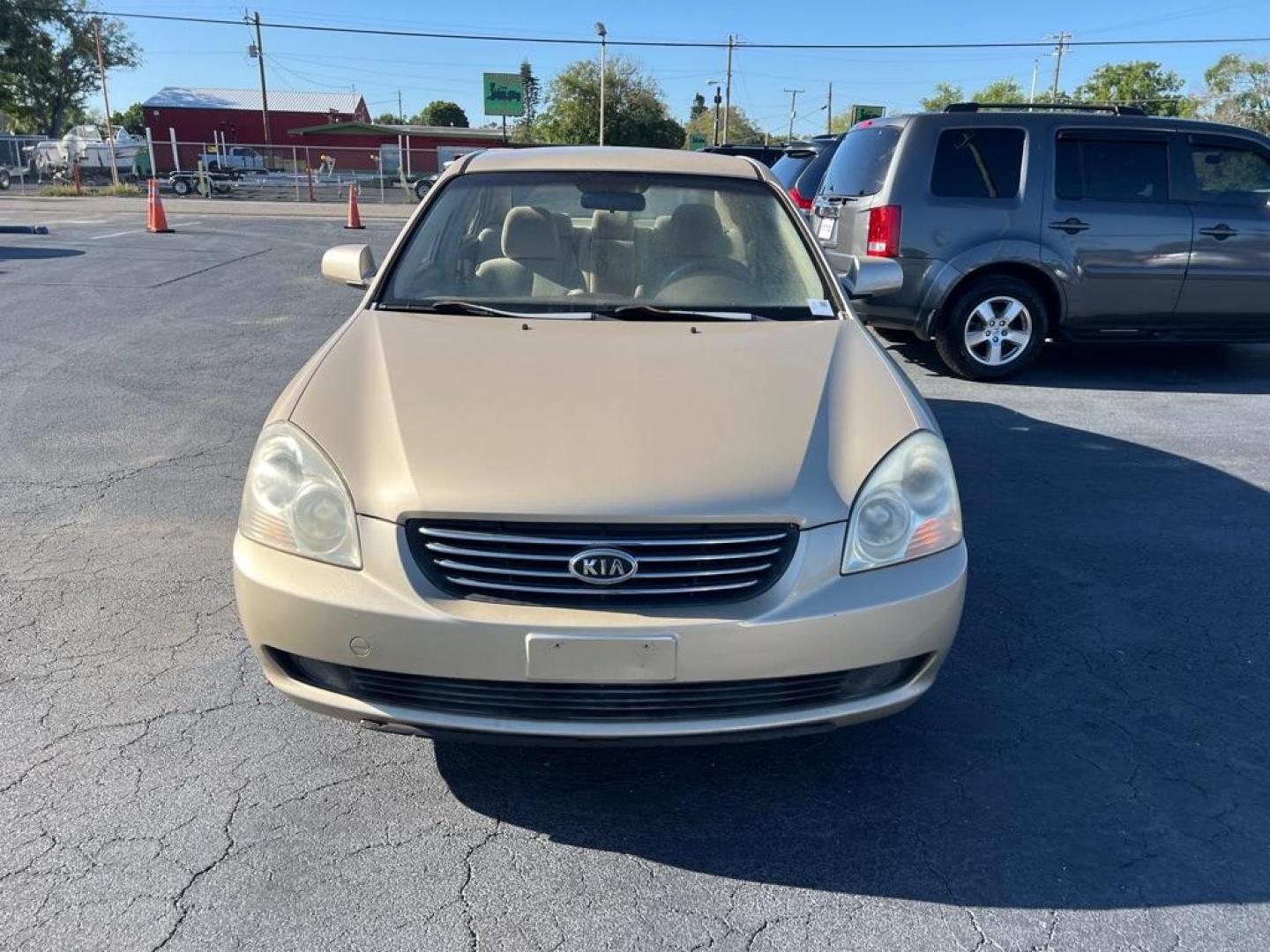 2008 GOLD KIA OPTIMA LX (KNAGE124385) with an 2.7L engine, Automatic transmission, located at 2929 9th St. West, Bradenton, 34205, (941) 242-2810, 27.473591, -82.570679 - Photo#2