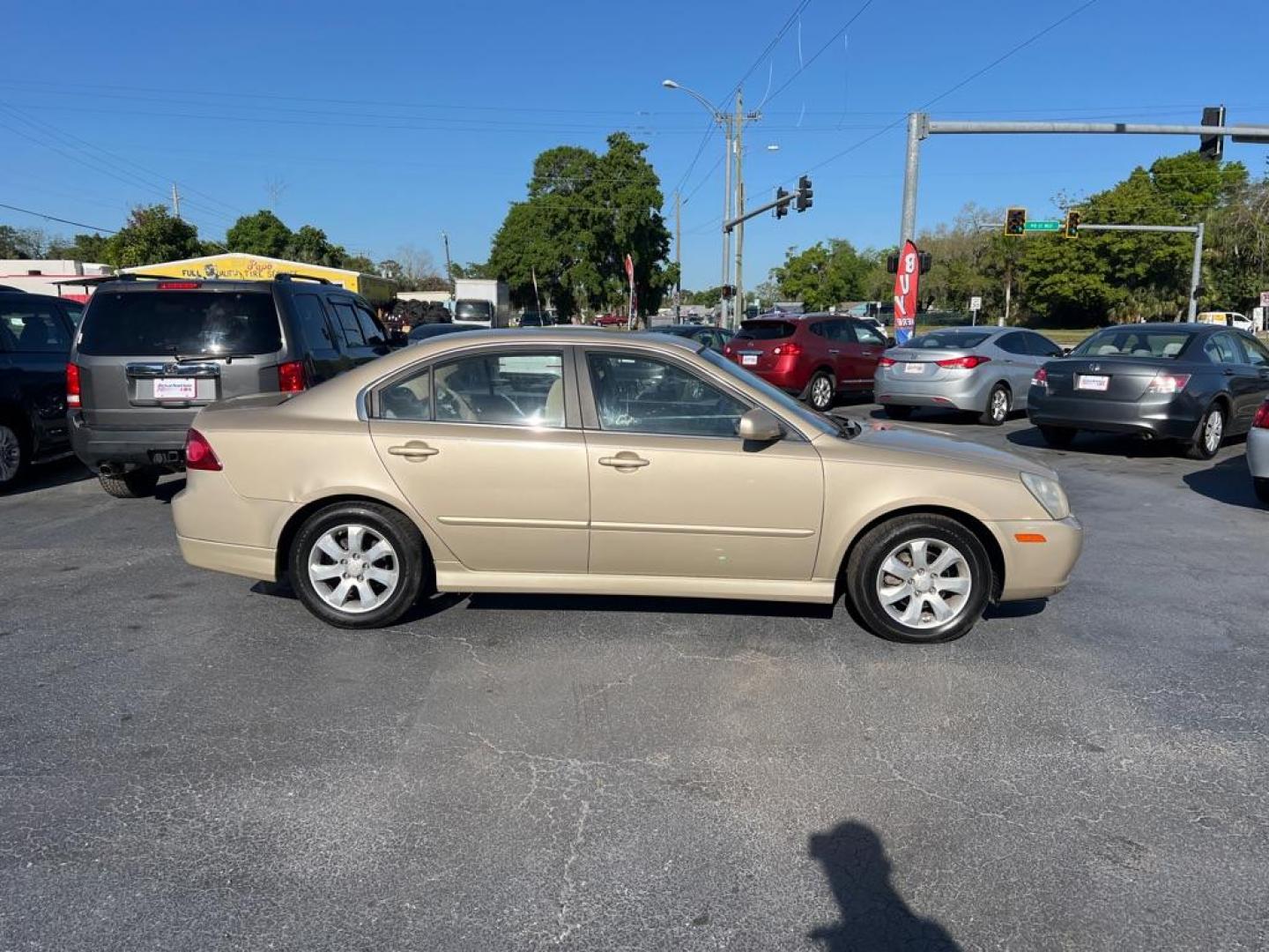 2008 GOLD KIA OPTIMA LX (KNAGE124385) with an 2.7L engine, Automatic transmission, located at 2929 9th St. West, Bradenton, 34205, (941) 242-2810, 27.473591, -82.570679 - Photo#7