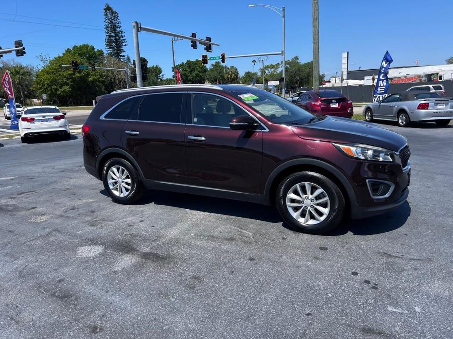 2016 RED KIA SORENTO LX (5XYPG4A53GG) with an 3.3L engine, Automatic transmission, located at 2929 9th St. West, Bradenton, 34205, (941) 242-2810, 27.473591, -82.570679 - Photo#0