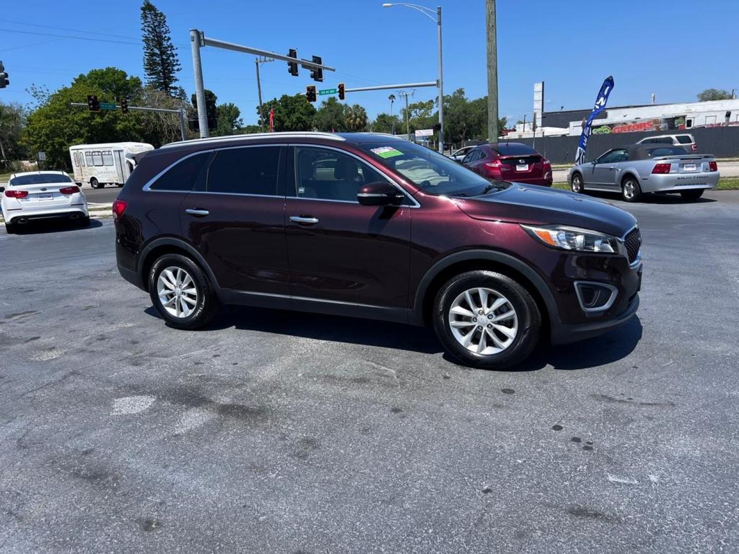 2016 RED KIA SORENTO LX (5XYPG4A53GG) with an 3.3L engine, Automatic transmission, located at 2929 9th St. West, Bradenton, 34205, (941) 242-2810, 27.473591, -82.570679 - Photo#1