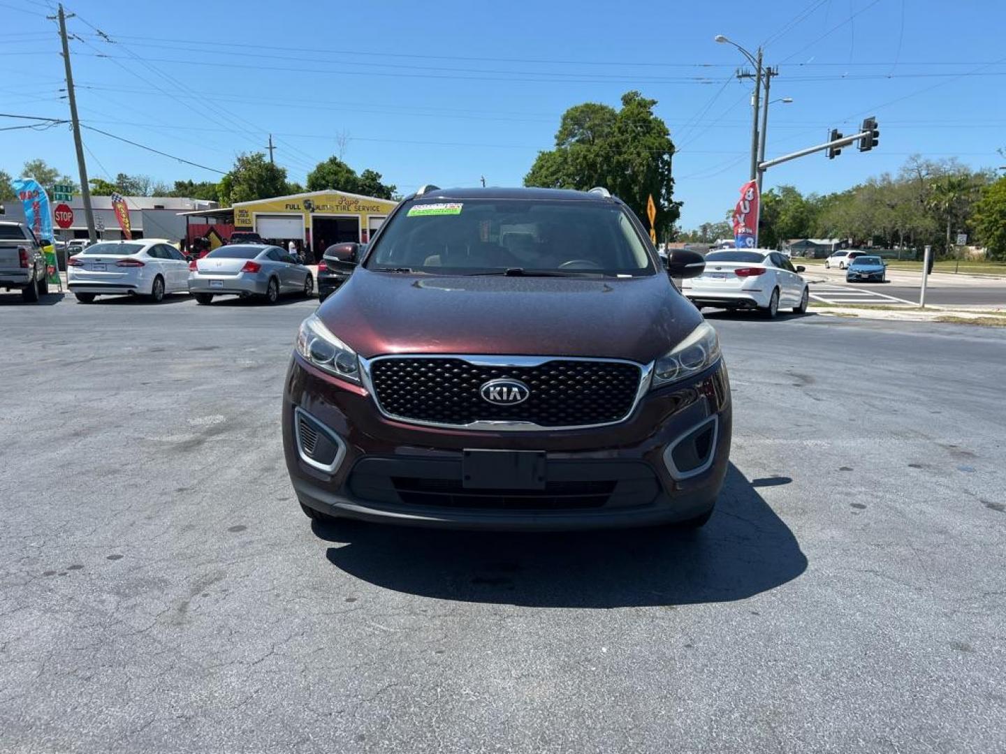 2016 RED KIA SORENTO LX (5XYPG4A53GG) with an 3.3L engine, Automatic transmission, located at 2929 9th St. West, Bradenton, 34205, (941) 242-2810, 27.473591, -82.570679 - Photo#2