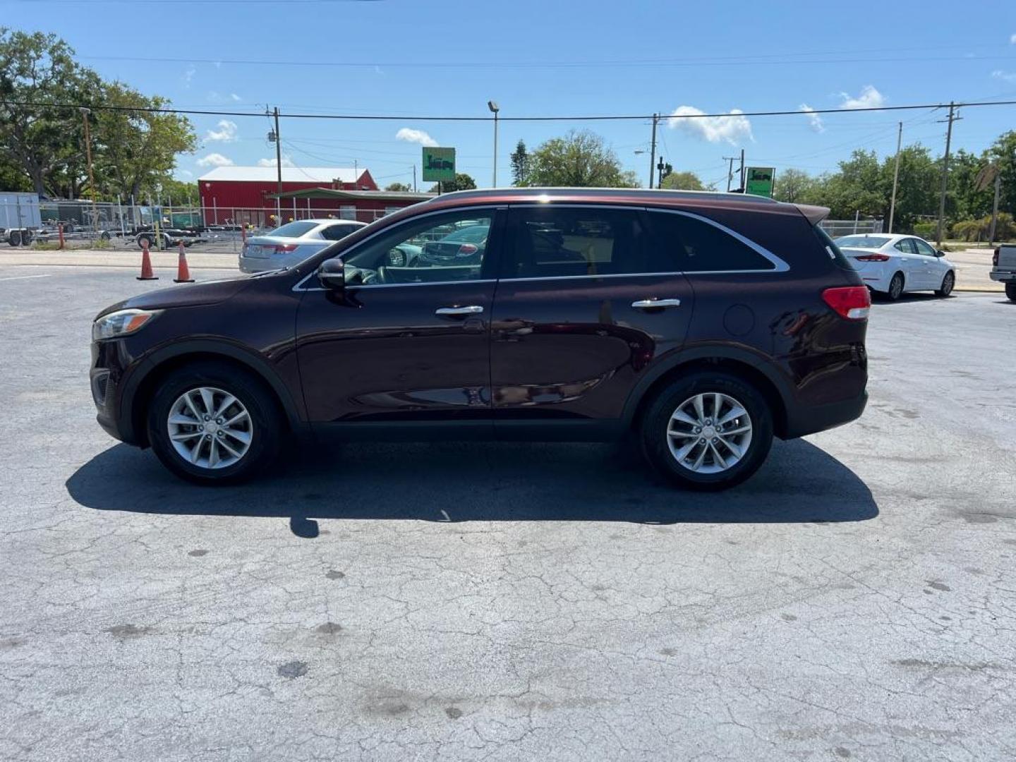 2016 RED KIA SORENTO LX (5XYPG4A53GG) with an 3.3L engine, Automatic transmission, located at 2929 9th St. West, Bradenton, 34205, (941) 242-2810, 27.473591, -82.570679 - Photo#4