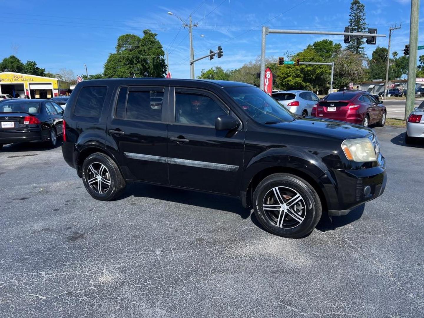 2011 BLACK HONDA PILOT LX (5FNYF3H20BB) with an 3.5L engine, Automatic transmission, located at 2929 9th St. West, Bradenton, 34205, (941) 242-2810, 27.473591, -82.570679 - Photo#2