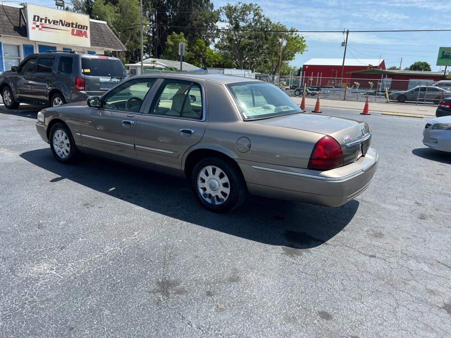 2006 TAN MERCURY GRAND MARQUIS LS (2MEFM75VX6X) with an 4.6L engine, Automatic transmission, located at 2929 9th St. West, Bradenton, 34205, (941) 242-2810, 27.473591, -82.570679 - Photo#4