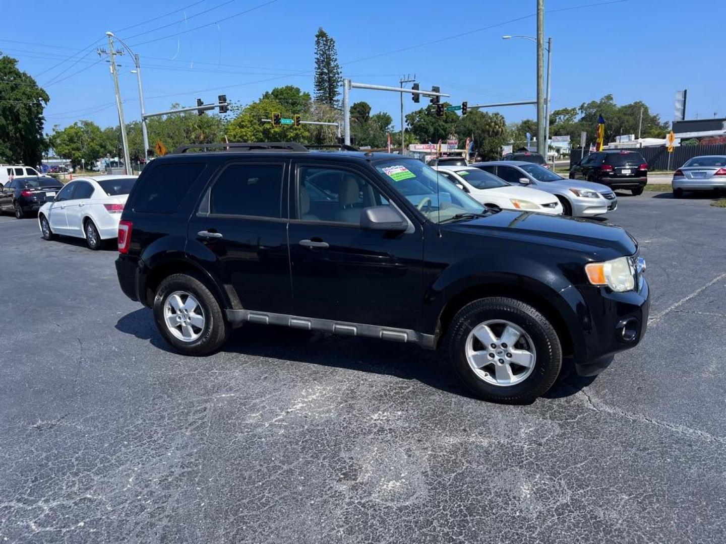 2010 BLACK FORD ESCAPE XLT (1FMCU0DG5AK) with an 3.0L engine, Automatic transmission, located at 2929 9th St. West, Bradenton, 34205, (941) 242-2810, 27.473591, -82.570679 - Photo#0