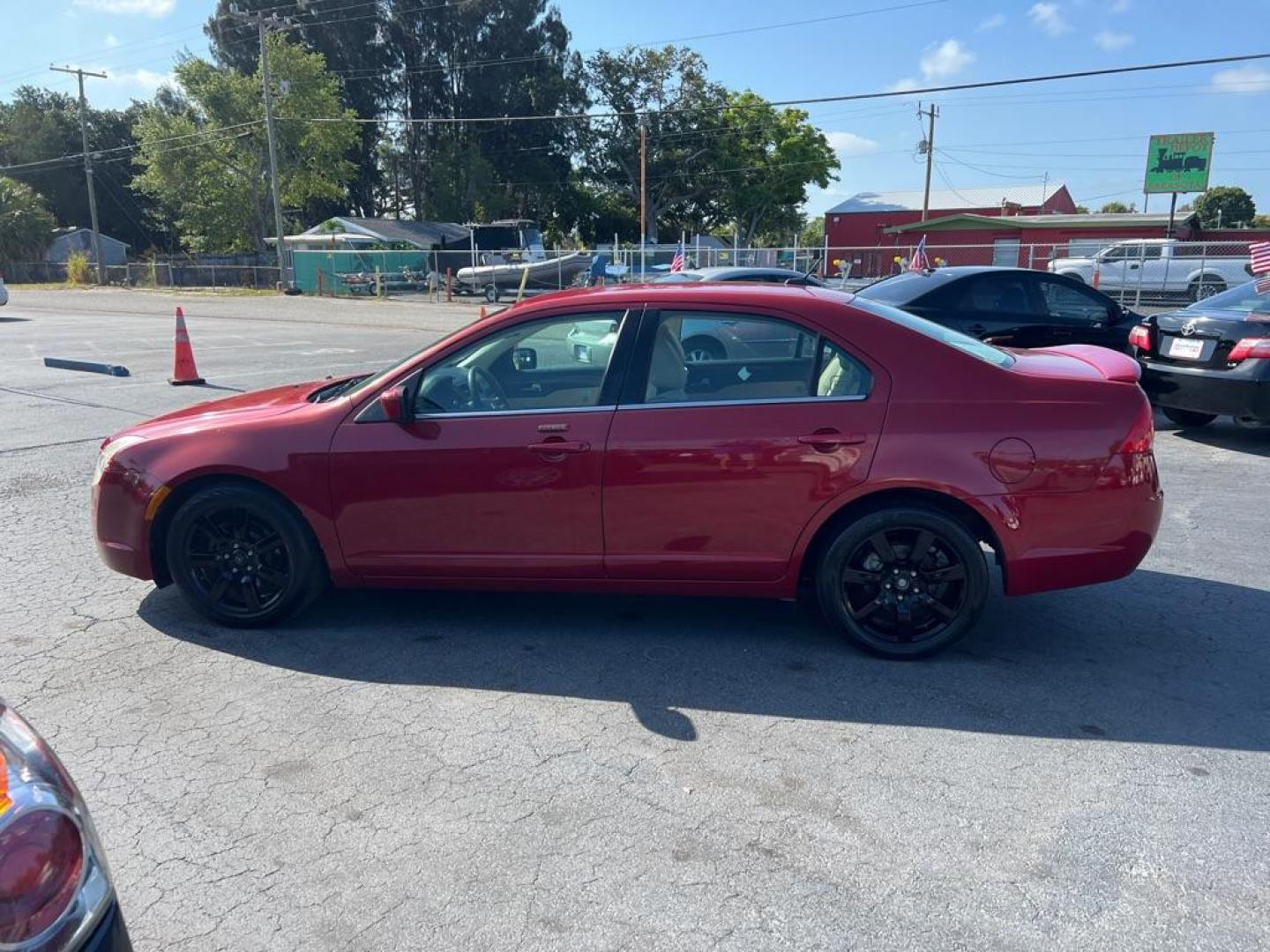 2010 RED MERCURY MILAN PREMIER (3MEHM0JA4AR) with an 2.5L engine, Automatic transmission, located at 2929 9th St. West, Bradenton, 34205, (941) 242-2810, 27.473591, -82.570679 - Photo#4