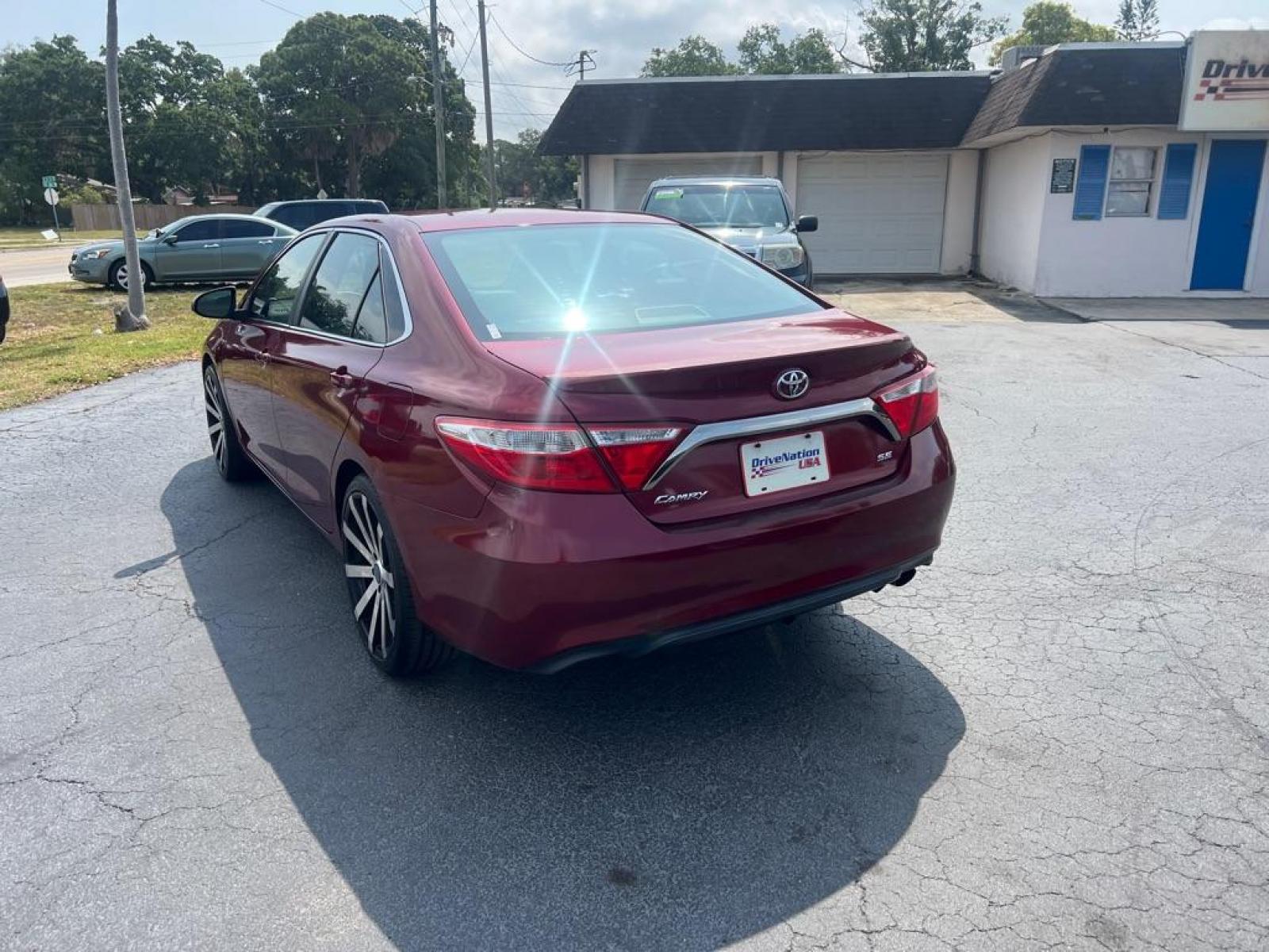 2016 RED TOYOTA CAMRY SE (4T1BF1FK8GU) with an 2.5L engine, Automatic transmission, located at 2929 9th St. West, Bradenton, 34205, (941) 242-2810, 27.473591, -82.570679 - Thanks for inquring into DriveNation USA! All vehicles listed can be viewed at www.drivenationusa.com for vehicle history reports and additonal info. We cannot quote any terms such as down payments or monthly payments without an application. You can apply directly at www.drivenationusa.com or by con - Photo #5