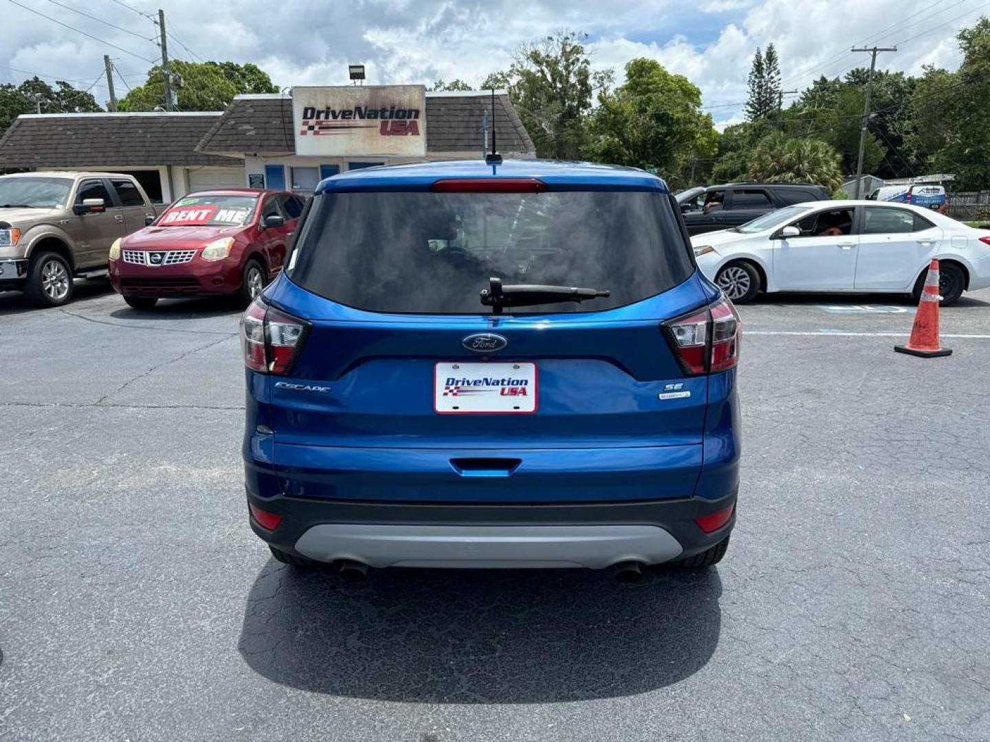 2017 BLUE FORD ESCAPE SE (1FMCU0GD8HU) with an 1.5L engine, Automatic transmission, located at 2929 9th St. West, Bradenton, 34205, (941) 242-2810, 27.473591, -82.570679 - Thanks for inquring into DriveNation USA! All vehicles listed can be viewed at www.drivenationusa.com for vehicle history reports and additonal info. We cannot quote any terms such as down payments or monthly payments without an application. You can apply directly at www.drivenationusa.com or by con - Photo#5