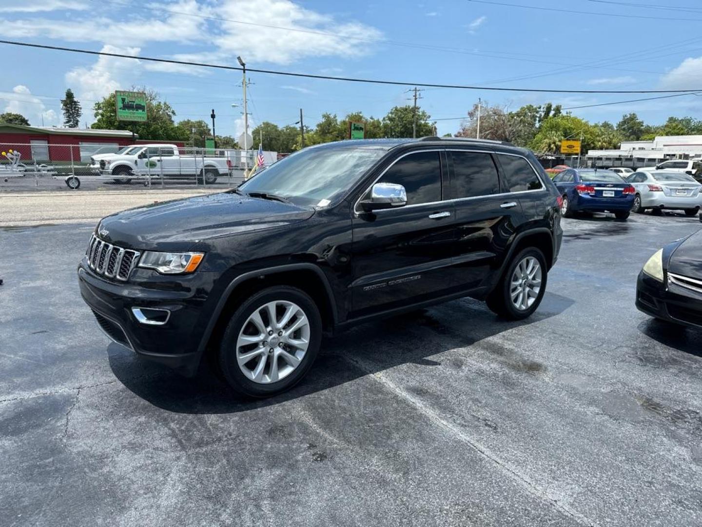 2017 BLACK JEEP GRAND CHEROKEE LIMITED (1C4RJEBG0HC) with an 3.6L engine, Automatic transmission, located at 2929 9th St. West, Bradenton, 34205, (941) 242-2810, 27.473591, -82.570679 - Photo#4