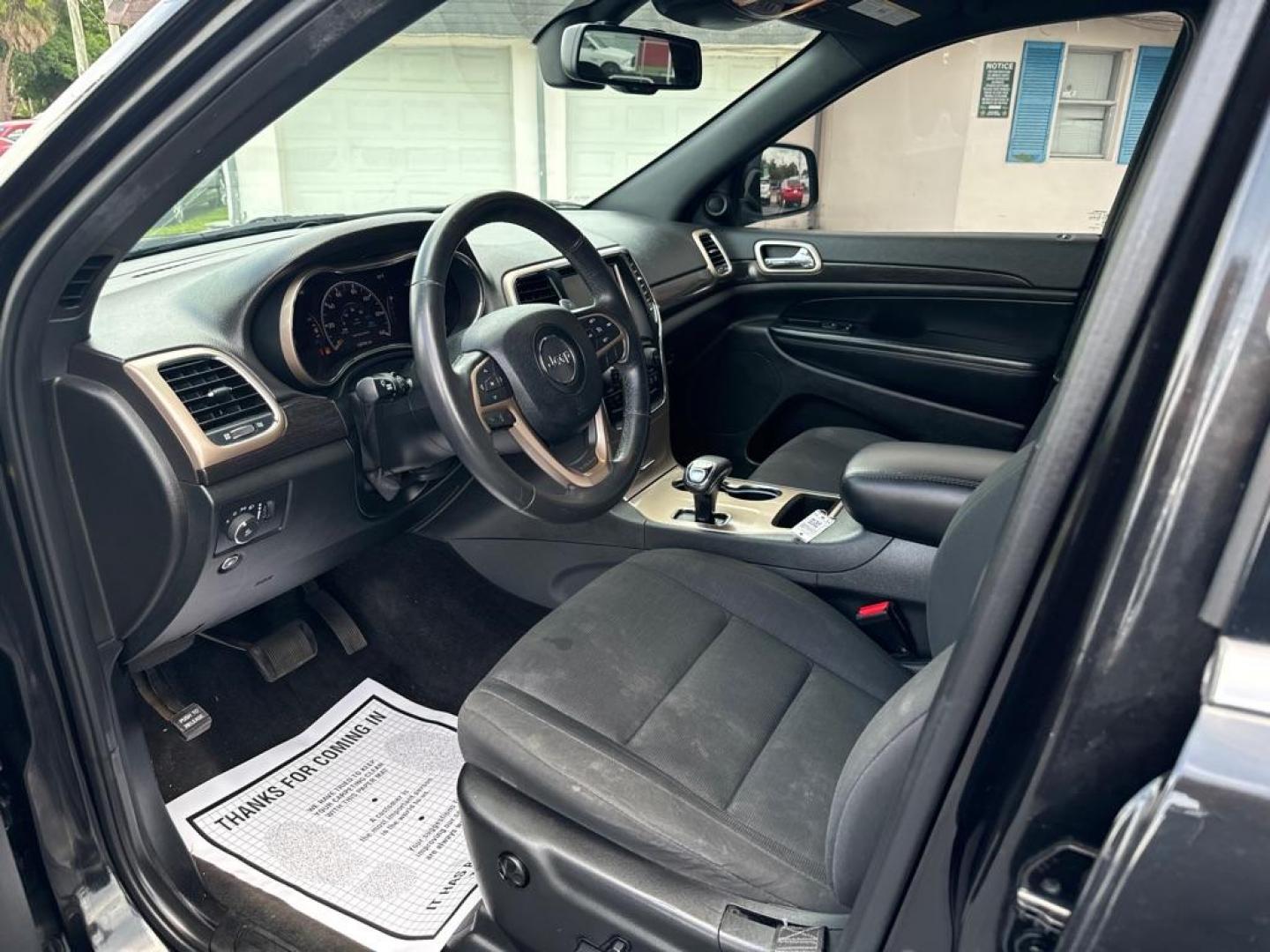 2015 BLACK JEEP GRAND CHEROKEE LAREDO (1C4RJFAG4FC) with an 3.6L engine, Automatic transmission, located at 2929 9th St. West, Bradenton, 34205, (941) 242-2810, 27.473591, -82.570679 - Thanks for inquring into DriveNation USA! All vehicles listed can be viewed at www.drivenationusa.com for vehicle history reports and additonal info. We cannot quote any terms such as down payments or monthly payments without an application. You can apply directly at www.drivenationusa.com or by con - Photo#10