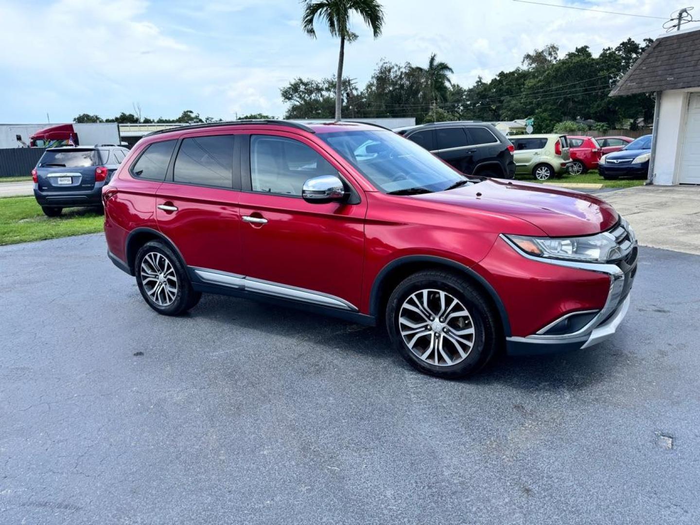 2016 RED MITSUBISHI OUTLANDER SEL (JA4AZ3A31GZ) with an 2.4L engine, Automatic transmission, located at 2929 9th St. West, Bradenton, 34205, (941) 242-2810, 27.473591, -82.570679 - Photo#1