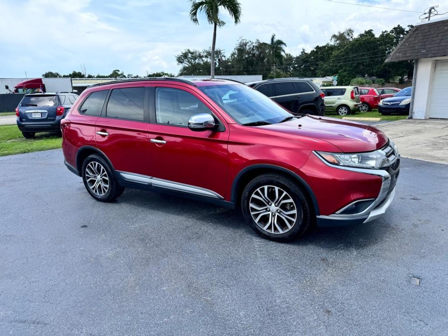 2016 RED MITSUBISHI OUTLANDER SEL (JA4AZ3A31GZ) with an 2.4L engine, Automatic transmission, located at 2929 9th St. West, Bradenton, 34205, (941) 242-2810, 27.473591, -82.570679 - Photo#2