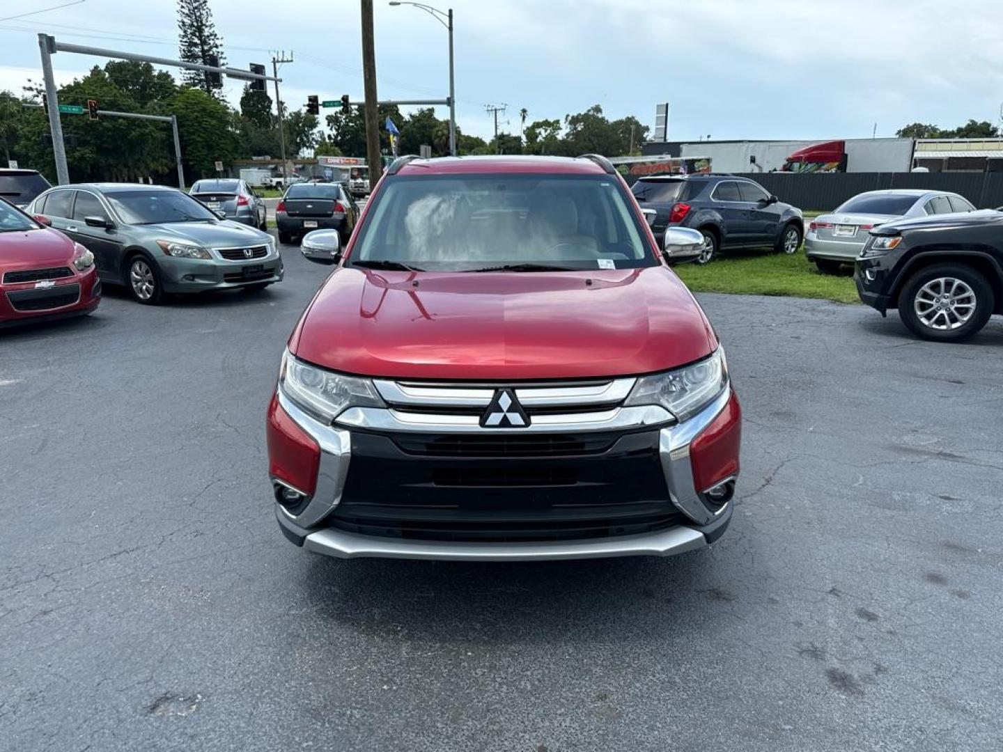 2016 RED MITSUBISHI OUTLANDER SEL (JA4AZ3A31GZ) with an 2.4L engine, Automatic transmission, located at 2929 9th St. West, Bradenton, 34205, (941) 242-2810, 27.473591, -82.570679 - Photo#3