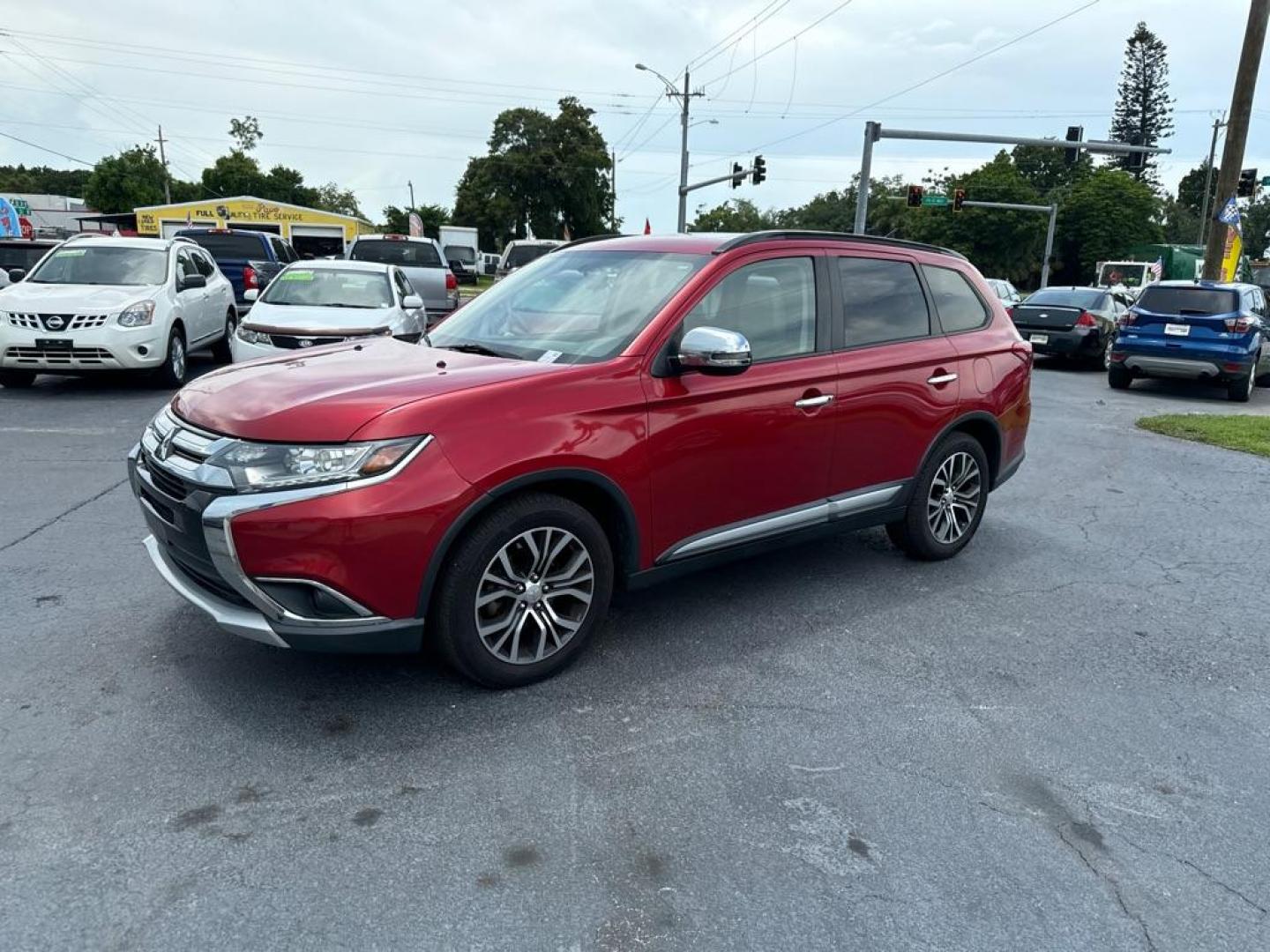 2016 RED MITSUBISHI OUTLANDER SEL (JA4AZ3A31GZ) with an 2.4L engine, Automatic transmission, located at 2929 9th St. West, Bradenton, 34205, (941) 242-2810, 27.473591, -82.570679 - Photo#4