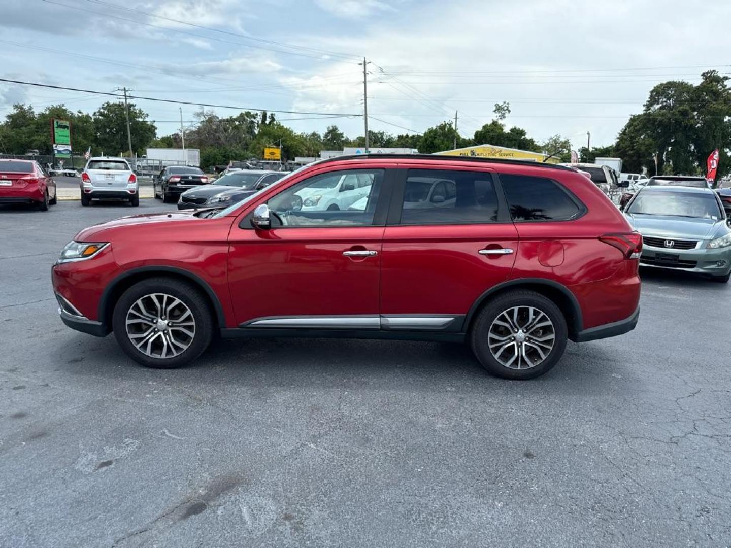 2016 RED MITSUBISHI OUTLANDER SEL (JA4AZ3A31GZ) with an 2.4L engine, Automatic transmission, located at 2929 9th St. West, Bradenton, 34205, (941) 242-2810, 27.473591, -82.570679 - Photo#5