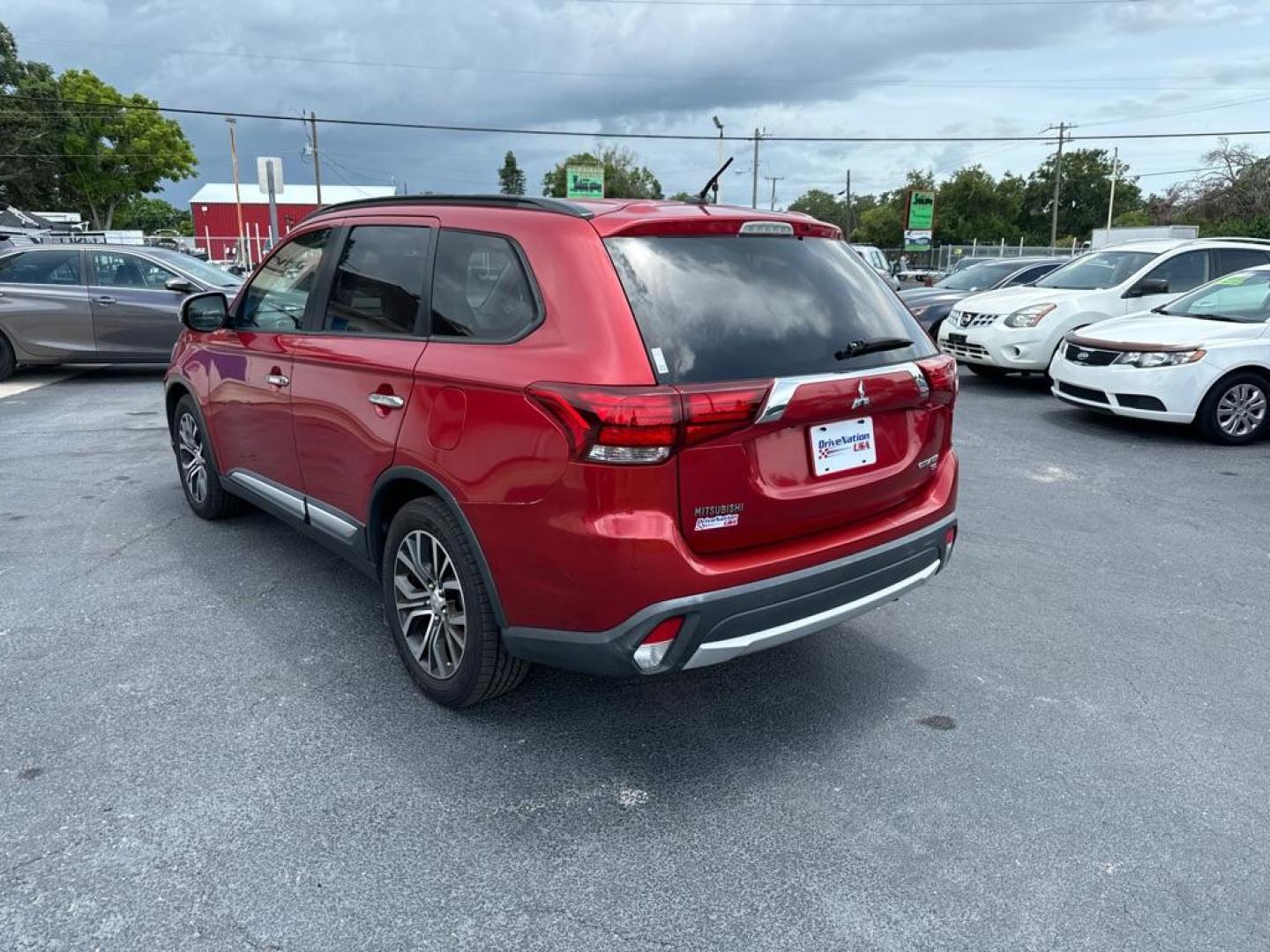 2016 RED MITSUBISHI OUTLANDER SEL (JA4AZ3A31GZ) with an 2.4L engine, Automatic transmission, located at 2929 9th St. West, Bradenton, 34205, (941) 242-2810, 27.473591, -82.570679 - Photo#6