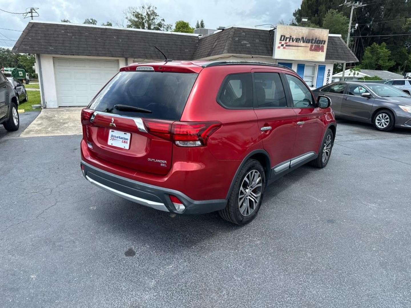 2016 RED MITSUBISHI OUTLANDER SEL (JA4AZ3A31GZ) with an 2.4L engine, Automatic transmission, located at 2929 9th St. West, Bradenton, 34205, (941) 242-2810, 27.473591, -82.570679 - Photo#7