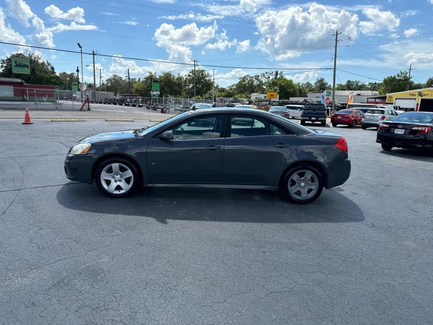 2009 GRAY PONTIAC G6 G6 (1G2ZJ57B694) with an 2.4L engine, Automatic transmission, located at 2929 9th St. West, Bradenton, 34205, (941) 242-2810, 27.473591, -82.570679 - Thanks for inquring into DriveNation USA! All vehicles listed can be viewed at www.drivenationusa.com for vehicle history reports and additonal info. We cannot quote any terms such as down payments or monthly payments without an application. You can apply directly at www.drivenationusa.com or by con - Photo#4