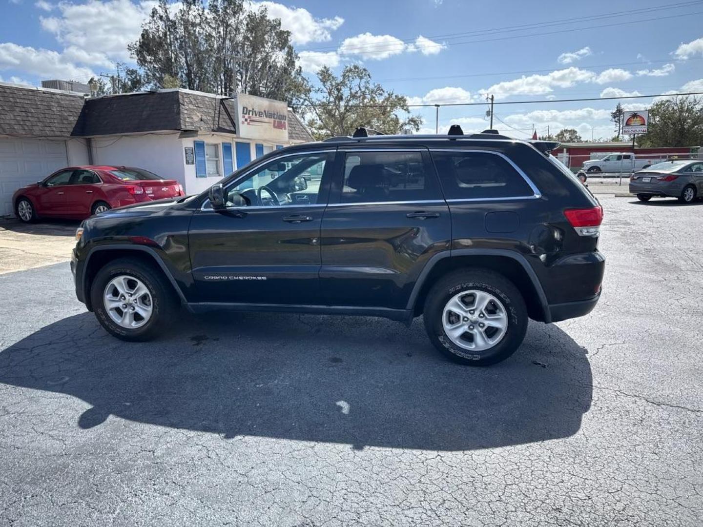 2014 BLACK JEEP GRAND CHEROKEE LAREDO (1C4RJFAG5EC) with an 3.6L engine, Automatic transmission, located at 2929 9th St. West, Bradenton, 34205, (941) 242-2810, 27.473591, -82.570679 - Thanks for inquring into DriveNation USA! All vehicles listed can be viewed at www.drivenationusa.com for vehicle history reports and additonal info. We cannot quote any terms such as down payments or monthly payments without an application. You can apply directly at www.drivenationusa.com or by con - Photo#4