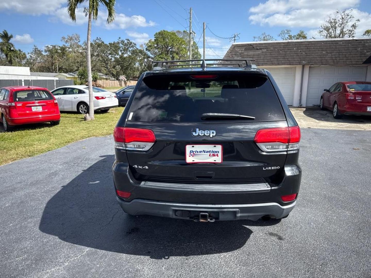 2014 BLACK JEEP GRAND CHEROKEE LAREDO (1C4RJFAG5EC) with an 3.6L engine, Automatic transmission, located at 2929 9th St. West, Bradenton, 34205, (941) 242-2810, 27.473591, -82.570679 - Thanks for inquring into DriveNation USA! All vehicles listed can be viewed at www.drivenationusa.com for vehicle history reports and additonal info. We cannot quote any terms such as down payments or monthly payments without an application. You can apply directly at www.drivenationusa.com or by con - Photo#6