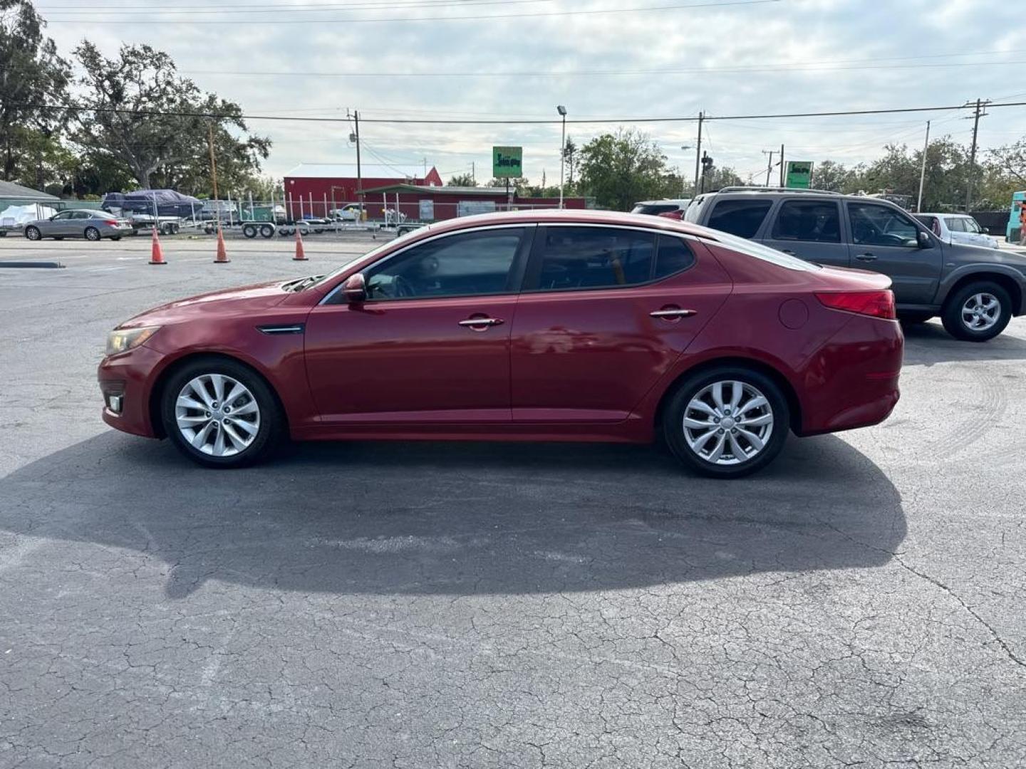 2015 RED KIA OPTIMA EX (5XXGN4A71FG) with an 2.4L engine, Automatic transmission, located at 2929 9th St. West, Bradenton, 34205, (941) 242-2810, 27.473591, -82.570679 - Thanks for inquring into DriveNation USA! All vehicles listed can be viewed at www.drivenationusa.com for vehicle history reports and additonal info. We cannot quote any terms such as down payments or monthly payments without an application. You can apply directly at www.drivenationusa.com or by con - Photo#5