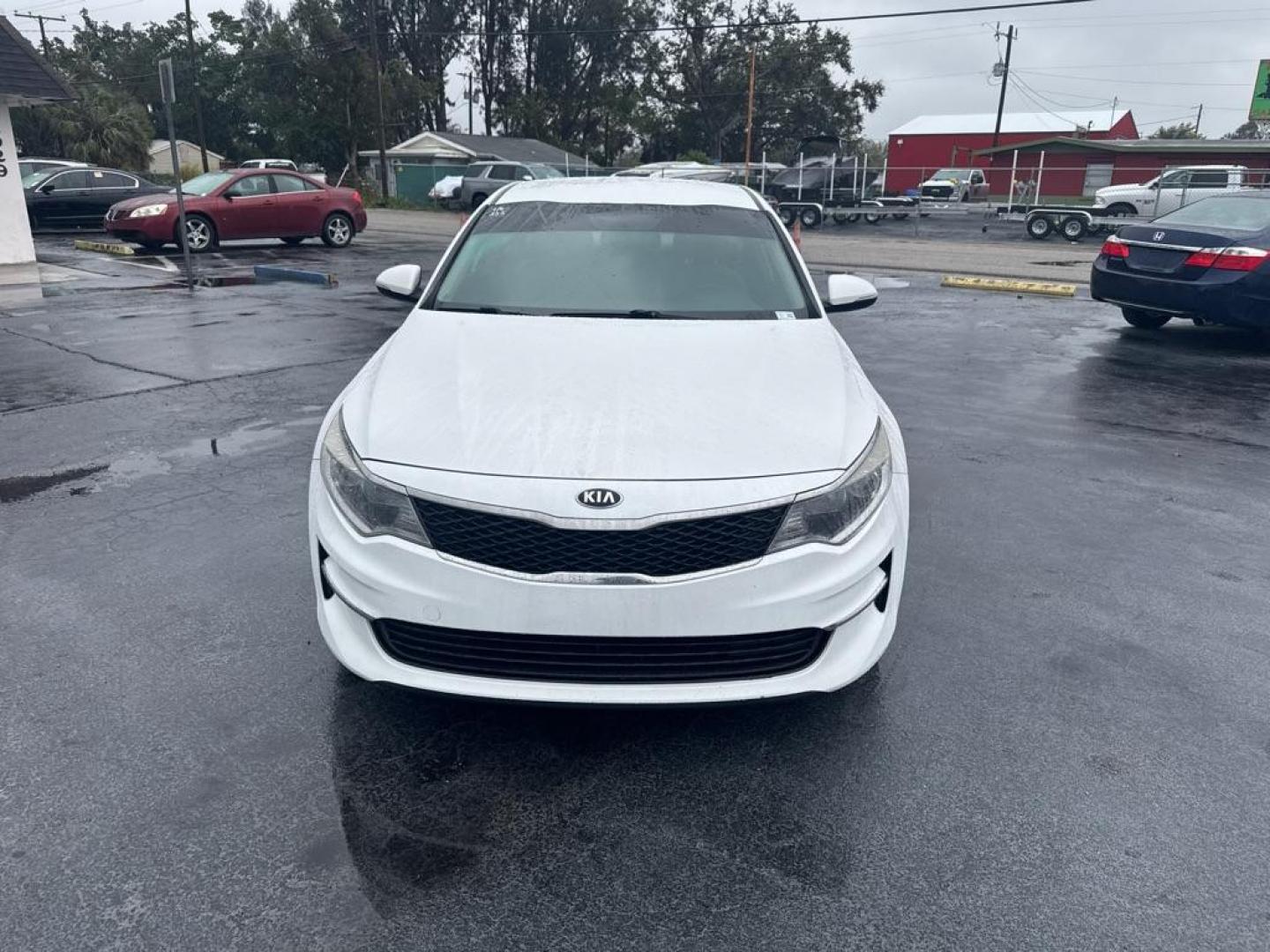 2016 WHITE KIA OPTIMA LX (KNAGT4L30G5) with an 2.4L engine, Automatic transmission, located at 2929 9th St. West, Bradenton, 34205, (941) 242-2810, 27.473591, -82.570679 - Thanks for inquring into DriveNation USA! All vehicles listed can be viewed at www.drivenationusa.com for vehicle history reports and additonal info. We cannot quote any terms such as down payments or monthly payments without an application. You can apply directly at www.drivenationusa.com or by con - Photo#3