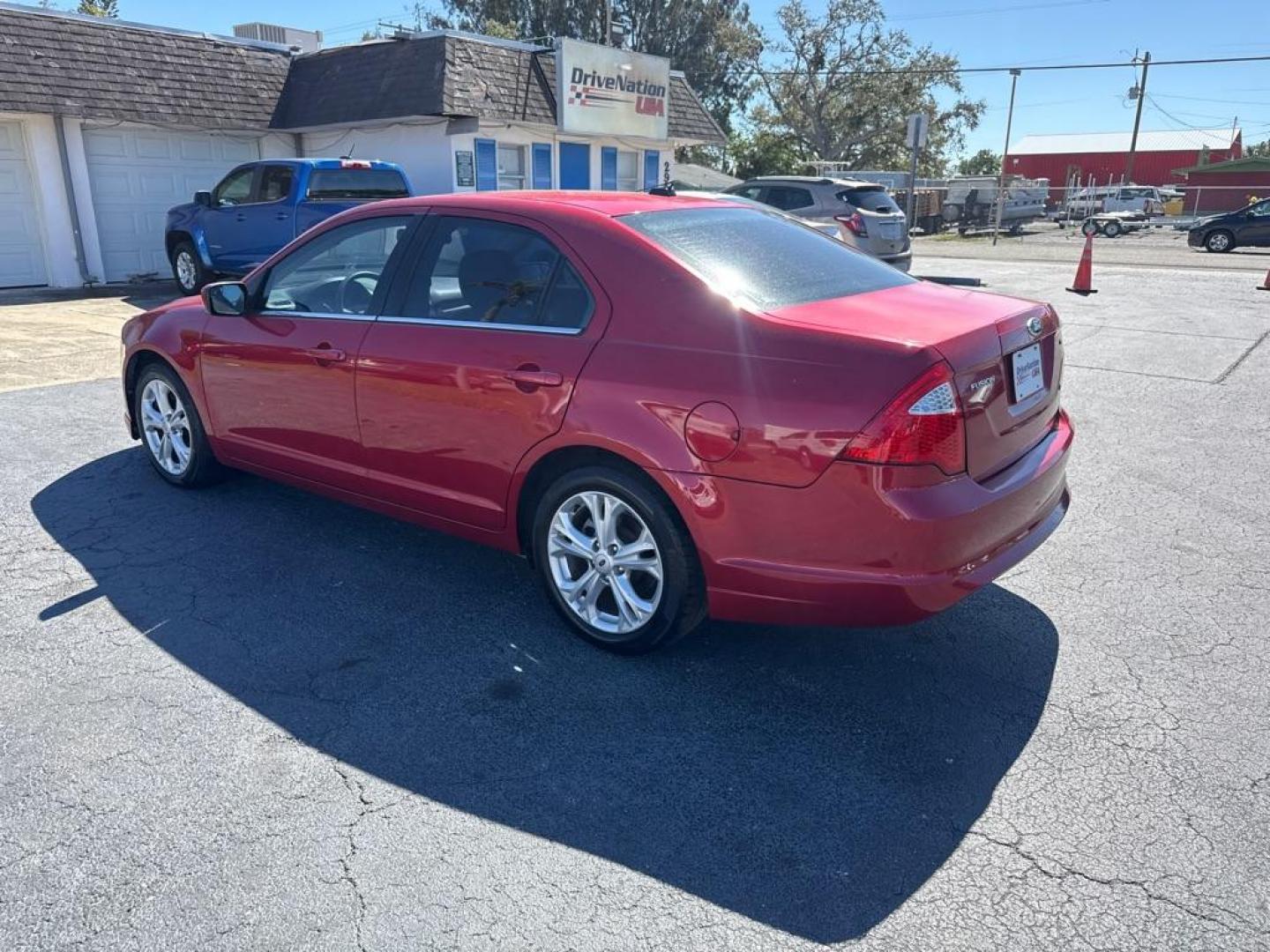 2012 RED FORD FUSION SE (3FAHP0HA6CR) with an 2.5L engine, Automatic transmission, located at 2929 9th St. West, Bradenton, 34205, (941) 242-2810, 27.473591, -82.570679 - Thanks for inquring into DriveNation USA! All vehicles listed can be viewed at www.drivenationusa.com for vehicle history reports and additonal info. We cannot quote any terms such as down payments or monthly payments without an application. You can apply directly at www.drivenationusa.com or by con - Photo#5